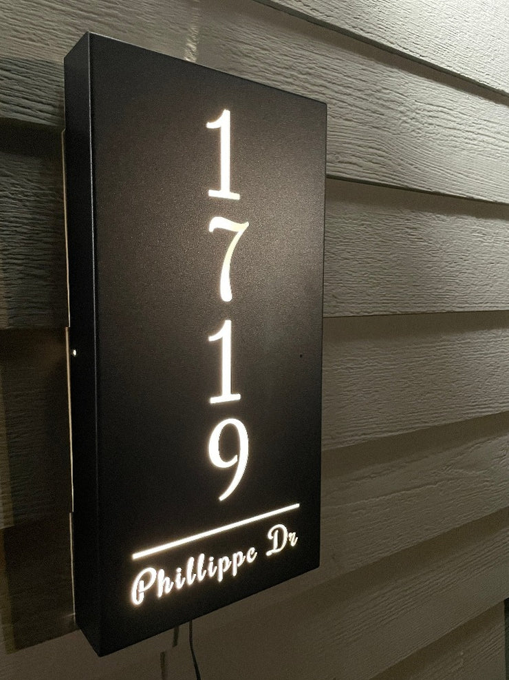 An illuminated Aluminum house sign that looks great during the day but truly shines at night with 46 LEDs and a dawn to dusk sensor - Black finish