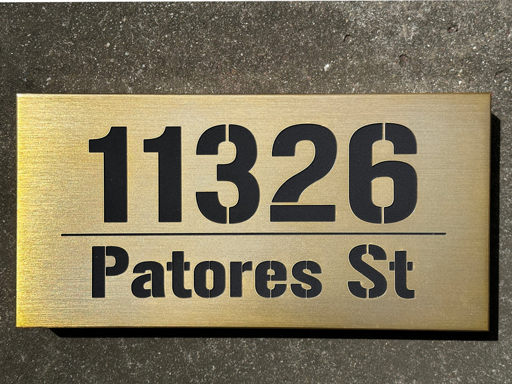 An illuminated Aluminum house sign that looks great during the day but truly shines at night with 46 LEDs and a dawn to dusk sensor - light Bronze finish