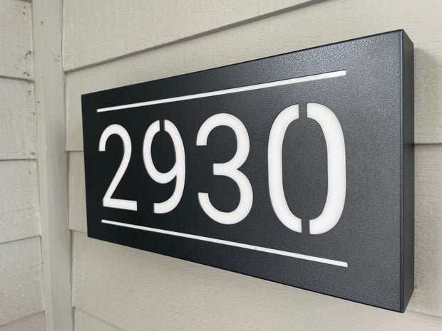 An illuminated Aluminum house sign that looks great during the day but truly shines at night with 46 LEDs and a dawn to dusk sensor - Black finish