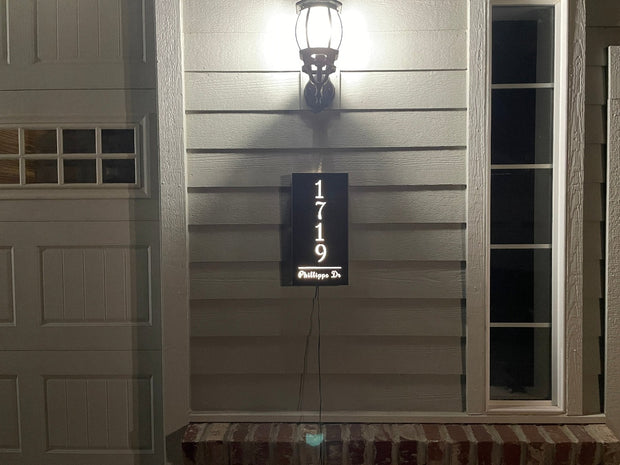 An illuminated Aluminum house sign that looks great during the day but truly shines at night with 46 LEDs and a dawn to dusk sensor - Black finish