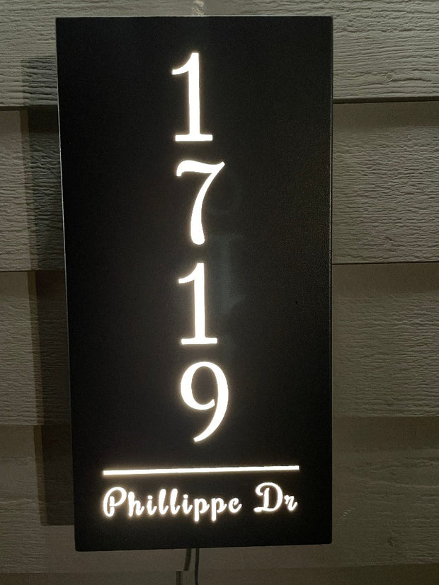 An illuminated Aluminum house sign that looks great during the day but truly shines at night with 46 LEDs and a dawn to dusk sensor - Black finish