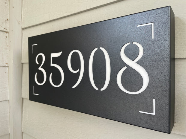 An illuminated Aluminum house sign that looks great during the day but truly shines at night with 46 LEDs and a dawn to dusk sensor - Black finish