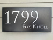 An illuminated Aluminum house sign that looks great during the day but truly shines at night with 46 LEDs and a dawn to dusk sensor - Black finish