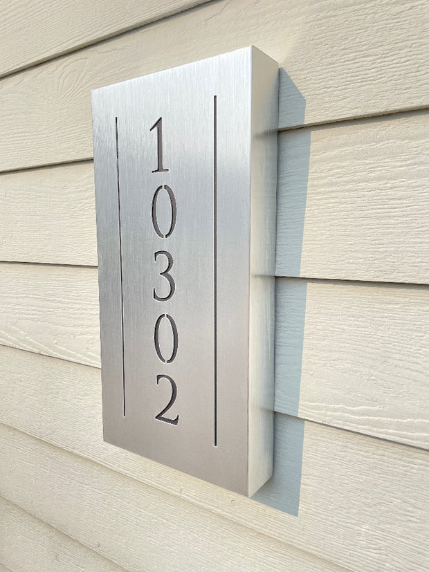 An illuminated Aluminum house sign that looks great during the day but truly shines at night with 46 LEDs and a dawn to dusk sensor -Brushed Aluminum