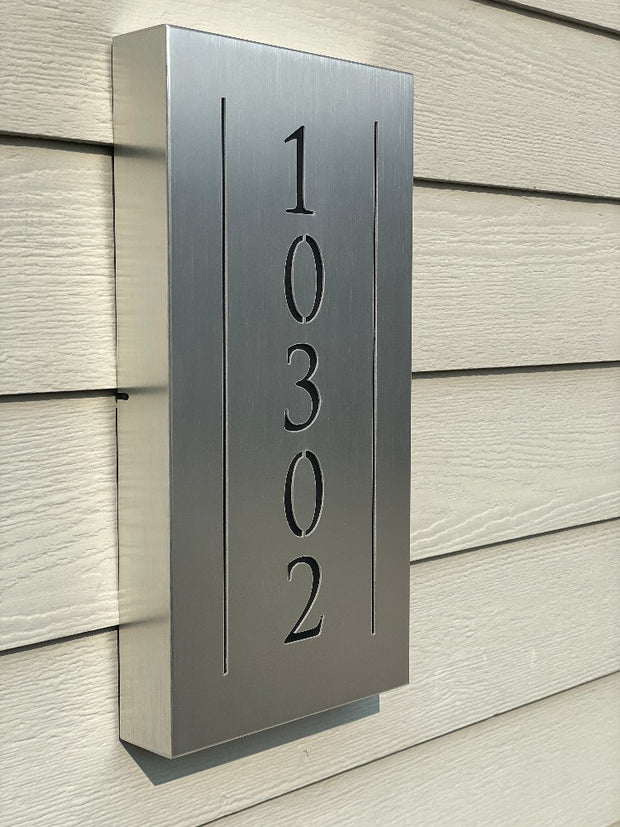 An illuminated Aluminum house sign that looks great during the day but truly shines at night with 46 LEDs and a dawn to dusk sensor -Brushed Aluminum