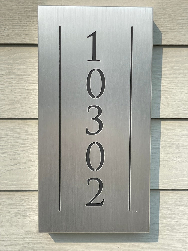 An illuminated Aluminum house sign that looks great during the day but truly shines at night with 46 LEDs and a dawn to dusk sensor -Brushed Aluminum