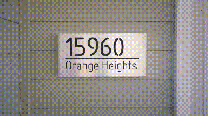 An illuminated Aluminum house sign that looks great during the day but truly shines at night with 46 LEDs and a dawn to dusk sensor - Black finish
